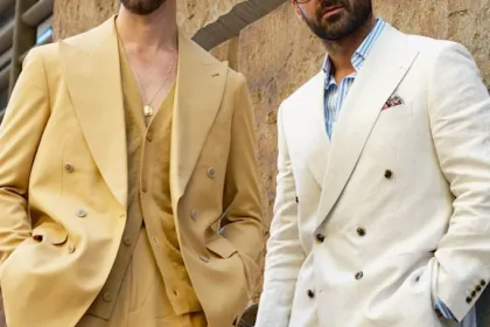 Two men in double-breasted summer suits, the cream linen jacket finished with a patterned silk pocket square